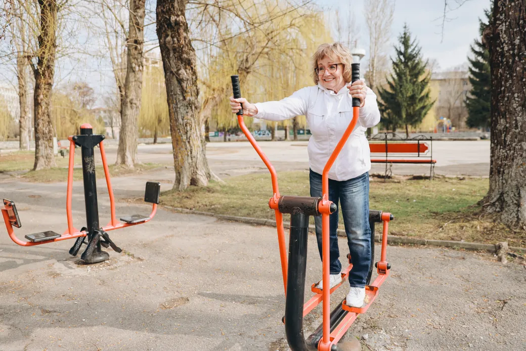 An older adult exercising outdoors, living independently