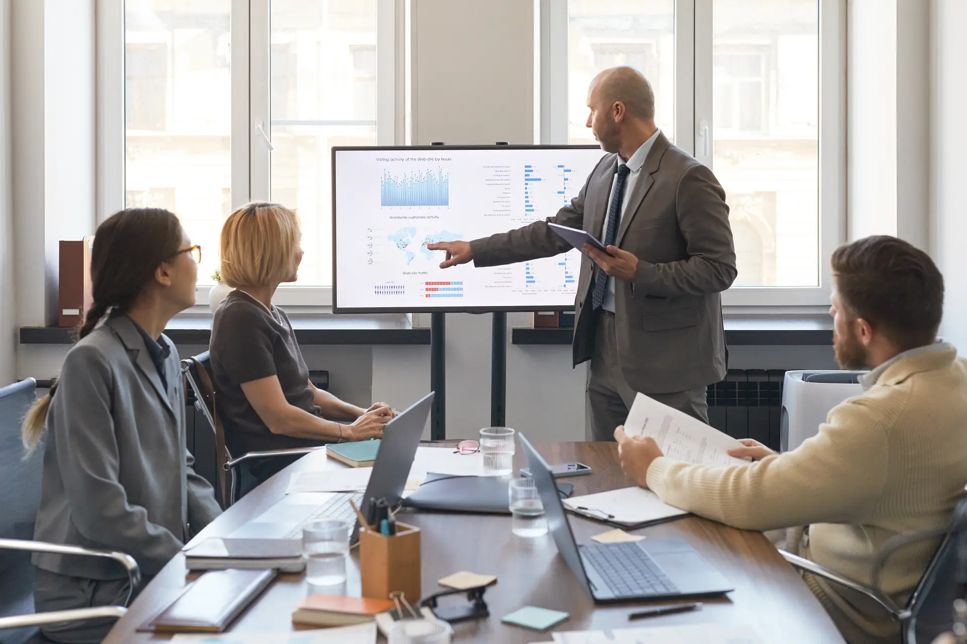A performance review session, results presented on screen
